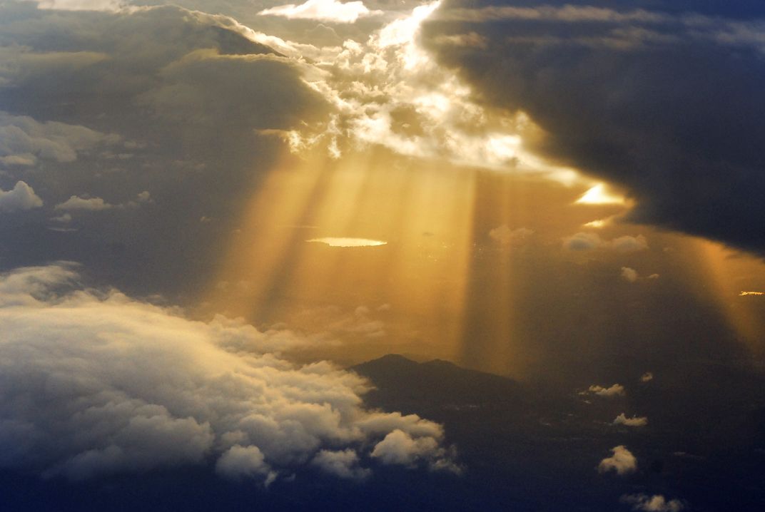 Sun rays as seen from an airplane. | Smithsonian Photo Contest ...