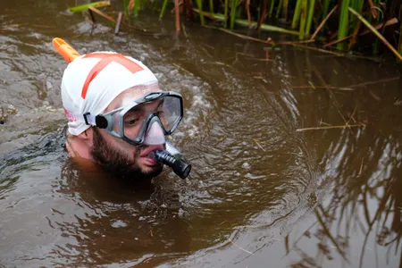 A competitor named Rich Welsh midway through his challenge at this year's World Bog Snorkeling Championships in Wales.