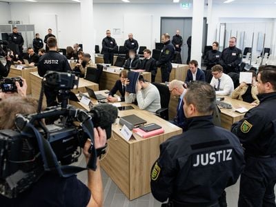 Defendants sit next to their lawyers at the Higher Regional Court in Dresden on January 10, 2023.