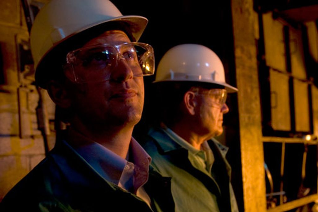 The Castens inside the furnace room at West Virginia Alloy.