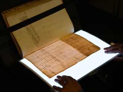 A lightsheet used to reveal hidden text in a manuscript of William Camden&#39;s Annals.&nbsp;New research suggests the author reworked his biography of Elizabeth I to win the favor of her successor, James VI of Scotland and I of England.