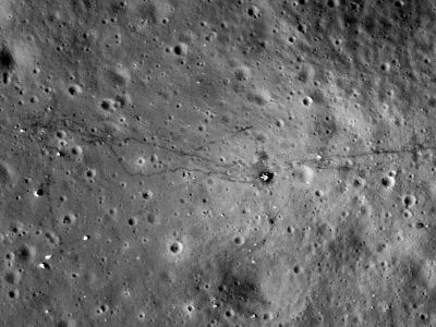 The Apollo 17 landing site, as photographed by the Lunar Reconnaissance Orbiter in 2009 and 2011. To the left of Challenger&rsquo;s descent stage (just right of center) are the astronauts' footpaths. To the right are tracks left by their moon buggy.