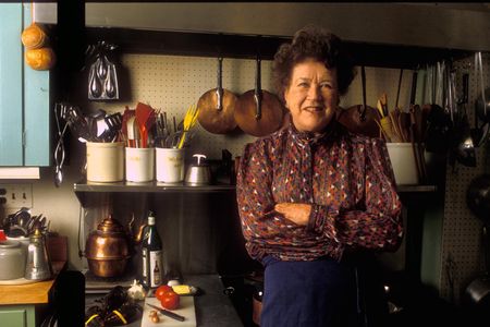 Julia Child stands in the kitchen of her Massachusetts home. You can own another one of her kitchens—the one in her Provence vacation home—for just $885,000. 
