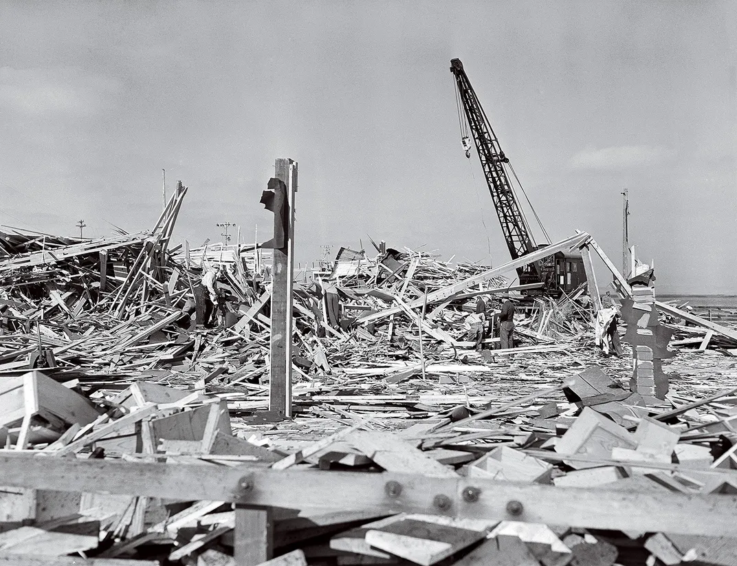 a black and white photograph of rubble after an explosion