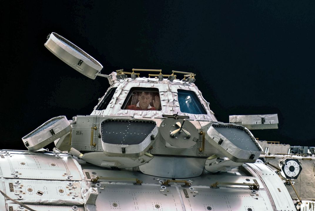 pictured from outside: Paolo Nespoli in cupola of ISS