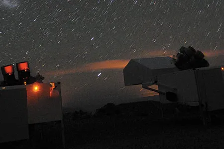 HATSouth telescopes search for dim planets orbiting the stars in Chile’s Atacama desert sky.