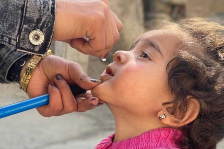 In February, the Covid-19 pandemic halted polio immunization campaigns across Afghanistan and Pakistan, fueling a new resurgence of polio in children. Here, a young girl is given the polio vaccine in the Kabul Province in October after campaigns were resumed.
