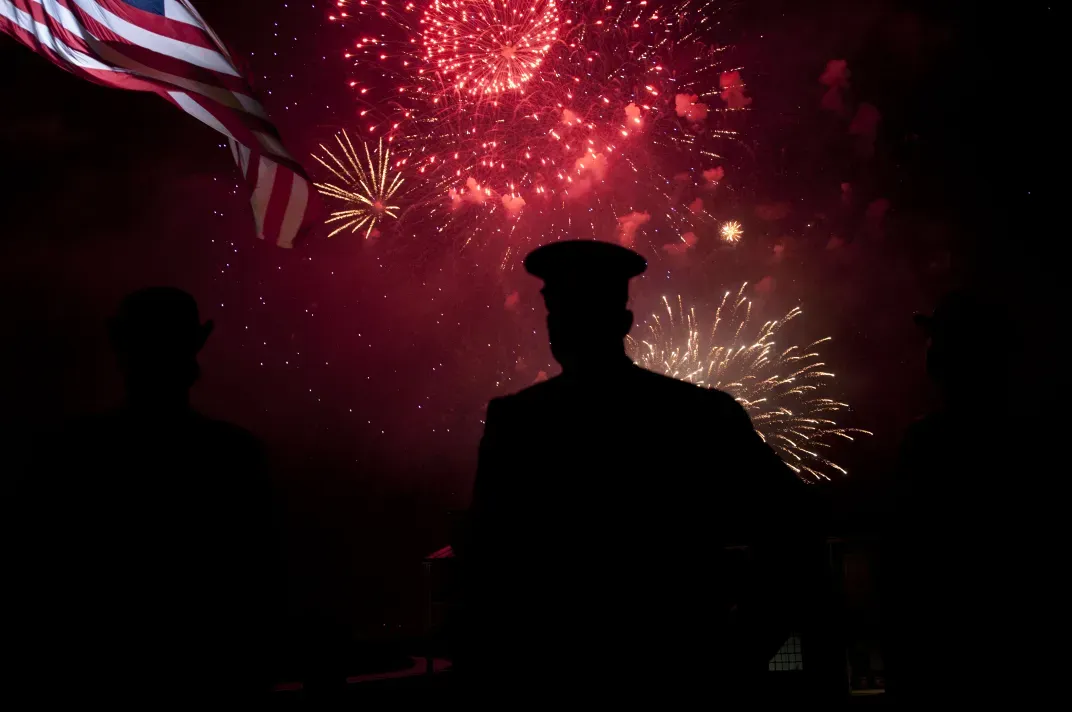 14 - A U.S. Army soldier at Baltimore’s Fort McHenry watches as fireworks erupt to mark the 200th anniversary of the penning of “The Star-Spangled Banner.”