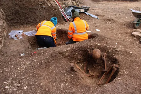 The 13 adults discovered at the site appear to have be positioned in a similar way: seated, with their backs resting against the eastern wall of a pit.