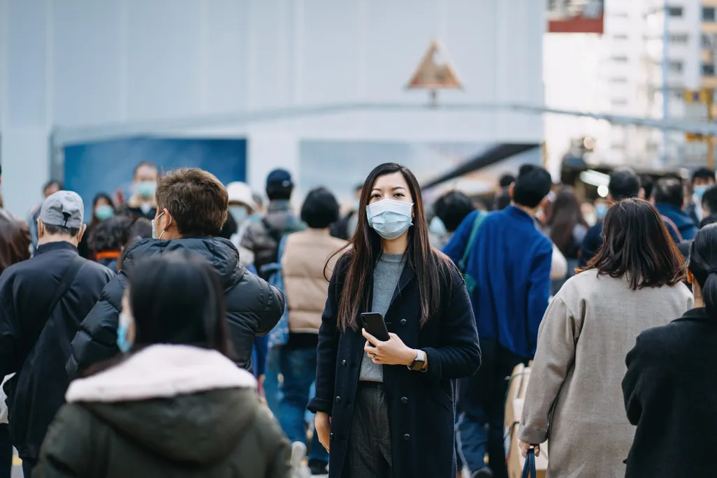 woman masked in crowd