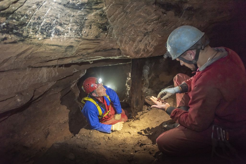 Two men inside a cave