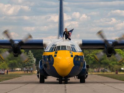 Fat Albert arrives at Traverse City, Michigan in 2018 with the crew chief (on top) spotting for any obstruction as it taxis on the tarmac.
