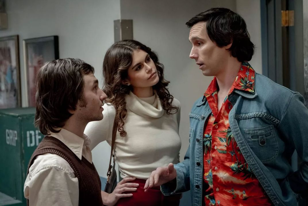 L to R: Gabriel LaBelle as Lorne Michaels, Kaia Gerber as Jacqueline Carlin and Cory Michael Smith as Chevy Chase in Saturday Night