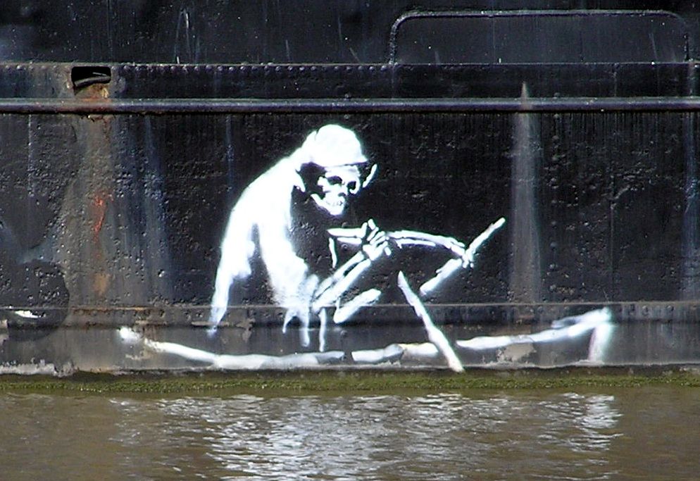 Stencil by Banksy on the waterline of The Thekla