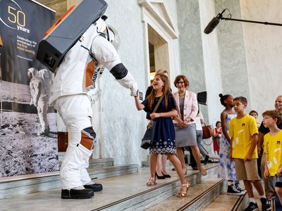 Spacesuit builders ILC Dover and Collins Aerospace showed off their privately developed Astro exploration suit at an event on Capitol Hill last July. NASA may need help from such commercial ventures if it hopes to make a 2024 moon landing.