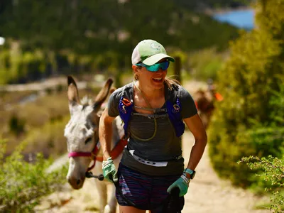 Jennifer Stewart and her burro Sheba tackle the 9-mile pack burro race in Georgetown, Colorado, in 2019.