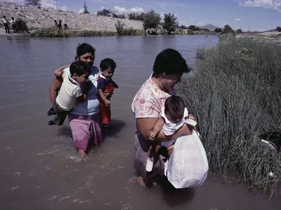 Mexican emigrants crossing the Rio Grande near El Paso, Texas.