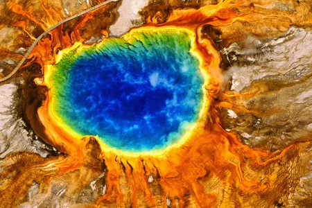 Yellowstone's Grand Prismatic Spring is the largest hot spring in the park. But what gives it its vivid rainbow colors?