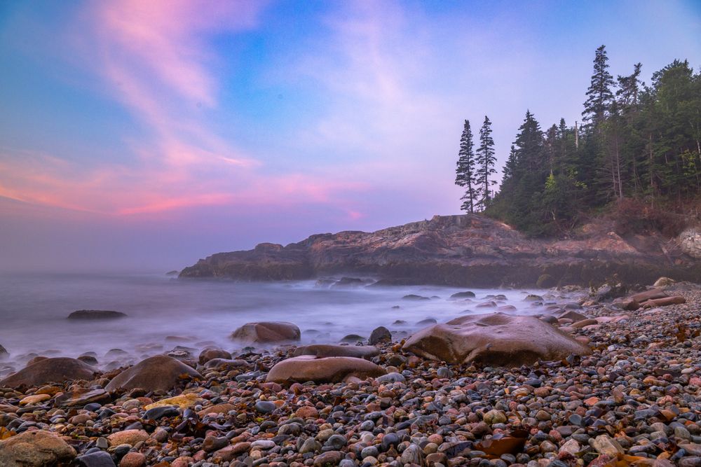 While I was exploring Acadia National Park, I came across this beach. I wanted to catch the sunrise colors the motion of the water through long exposure.