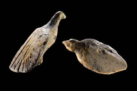 Each bird figurine measures less than an inch long.