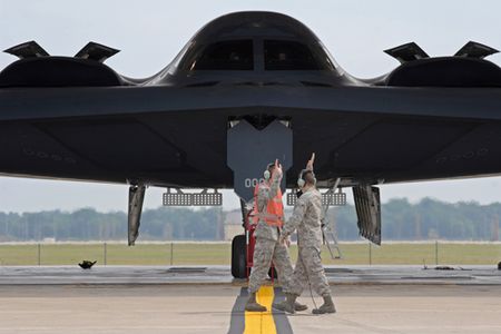 Airmen 1st Class Patrick Holter (left) and Patrick Dixon start the high-five salute as they prepare to launch the first B-2 Spirit of the day Sept. 8, 2009, on the Whiteman Air Force Base, Mo., flightline. The Airmen are crew chiefs with the 509th Aircraft Maintenance Squadron and work around the clock to stay prepared for real world missions. (U.S. Air Force photo/Senior Airman Kenny Holston)