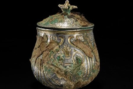 This silver lidded vessel was discovered in Scotland as part of the Galloway Hoard, but originates from Asia.