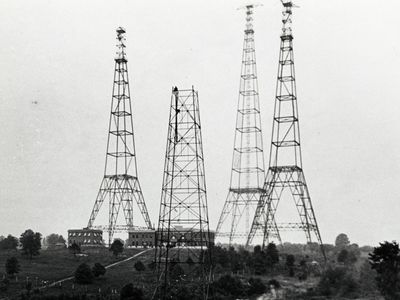 Radio towers like these, clustered on a hillside in Arlington, Virginia in the 1920s, have been leaking signals into space for decades. Our neighbors could be listening. 