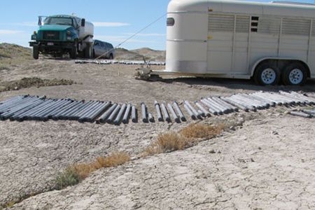 The products of our first day of coring. Drying in the hot Wyoming sun are segments of cores in their Lexan liners.