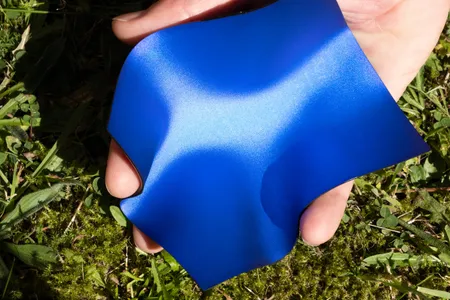 Pure Structural Color is made of several extremely thin sheets of non-conductive material. These layers are stacked together and imprinted, or stamped, with a nano-scale pattern of rods with curved ends.&nbsp;This pattern scatters light into colors that are visible from all directions, and different hues can be produced by changing the dimensions of the pattern.