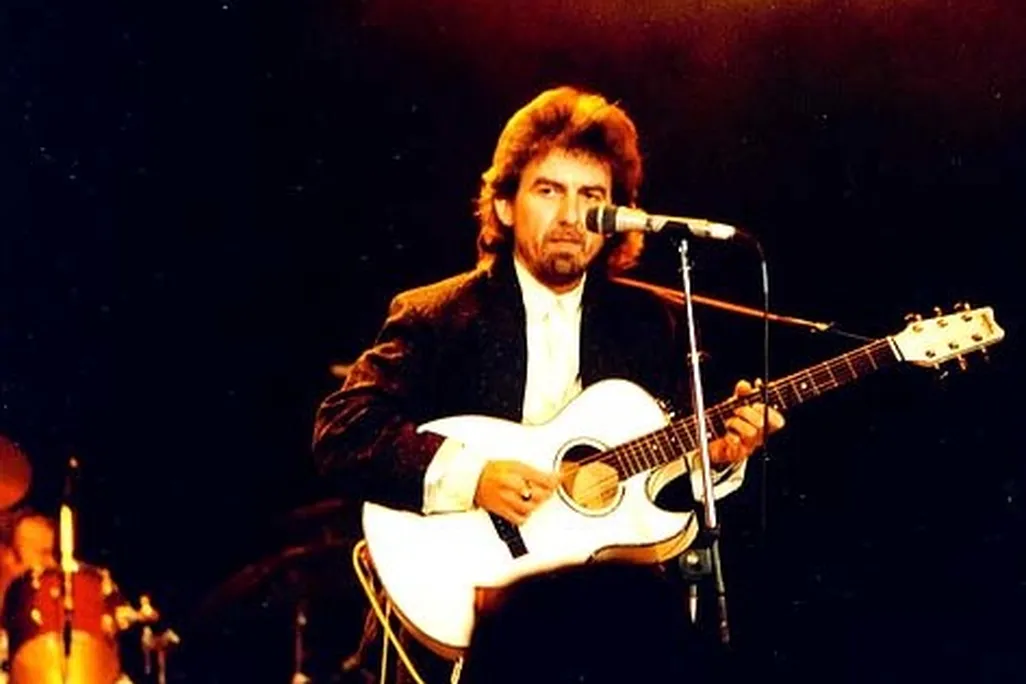 George Harrison playing guitar