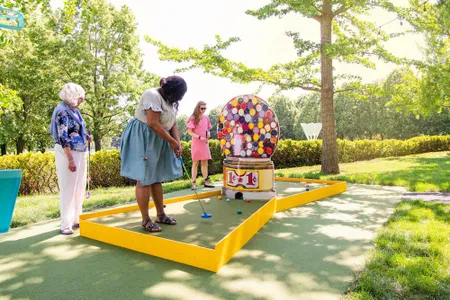 Wayne Thiebaud's "Jawbreaker Machine" (1963) is just one of the nine artworks reimagined as mini golf holes at "Art Course," an interactive exhibition at The Nelson-Atkins Museum in Kansas City, Missouri. 