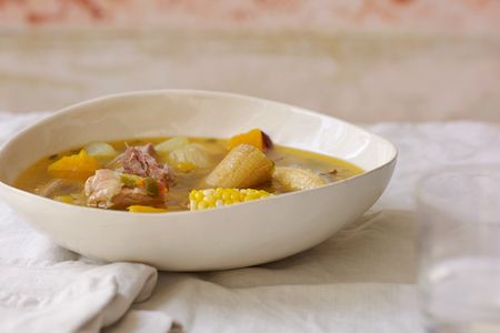 Chock-full of smoked meats and native vegetables like corn, plantains, and squash, ajiaco is a mainstay of Cuban cooking.
