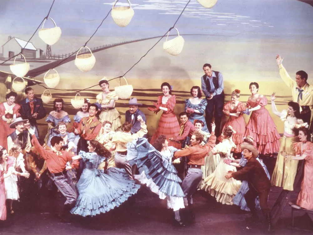An elaborate dance sequence from the 1943 production, choreographed by Agnes de Mille