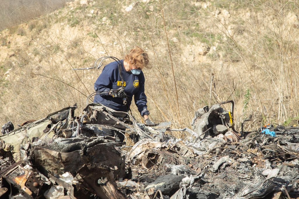 worker at a helicopter crash site