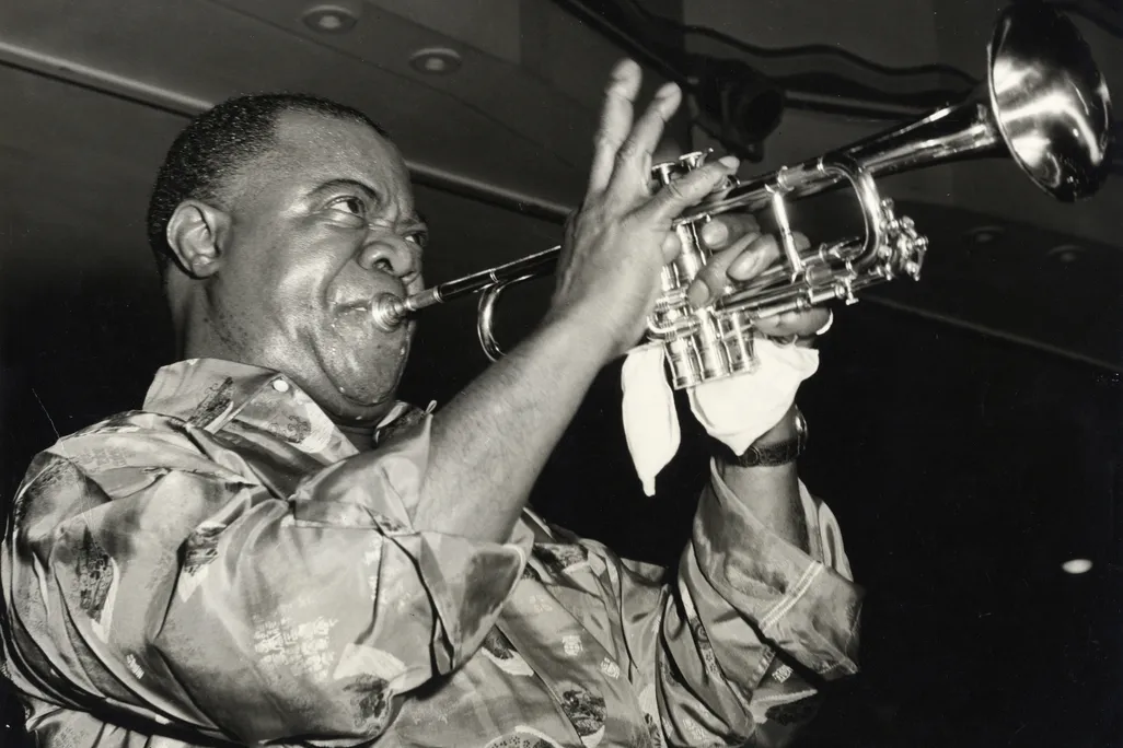Louis Armstrong playing his trumpet