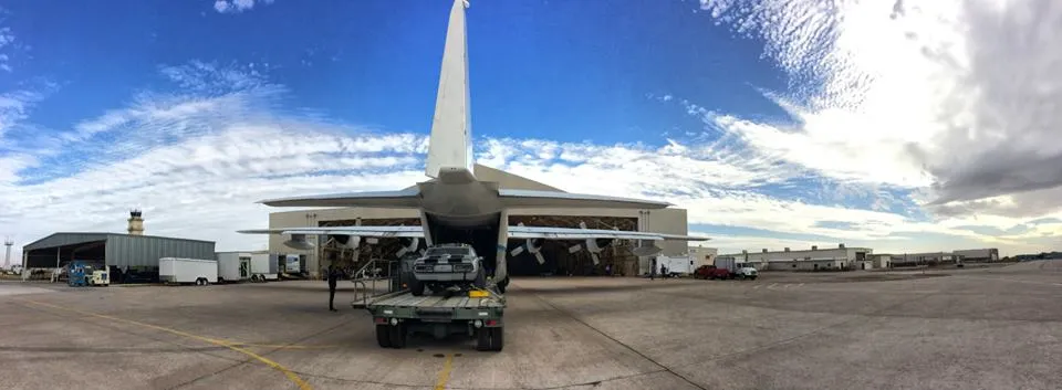 This car will be loaded, then dropped from above. Via IAR's Facebook