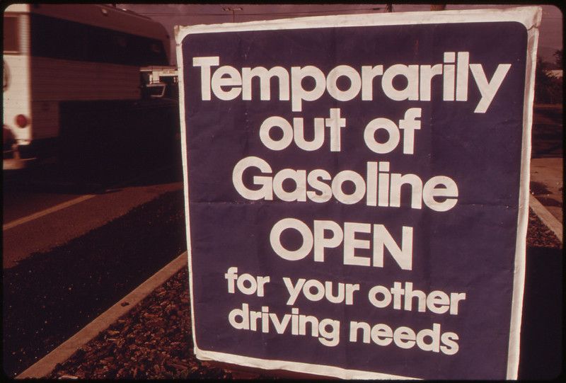 Sign reading "Temporarily out of gasoline. Open for your other driving needs"