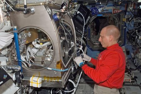 Anderson working inside the station's Destiny laboratory in 2007.