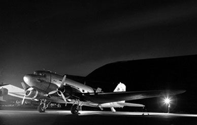 A loaded C-47 is poised to take off from a base in Vietnam, 1967.