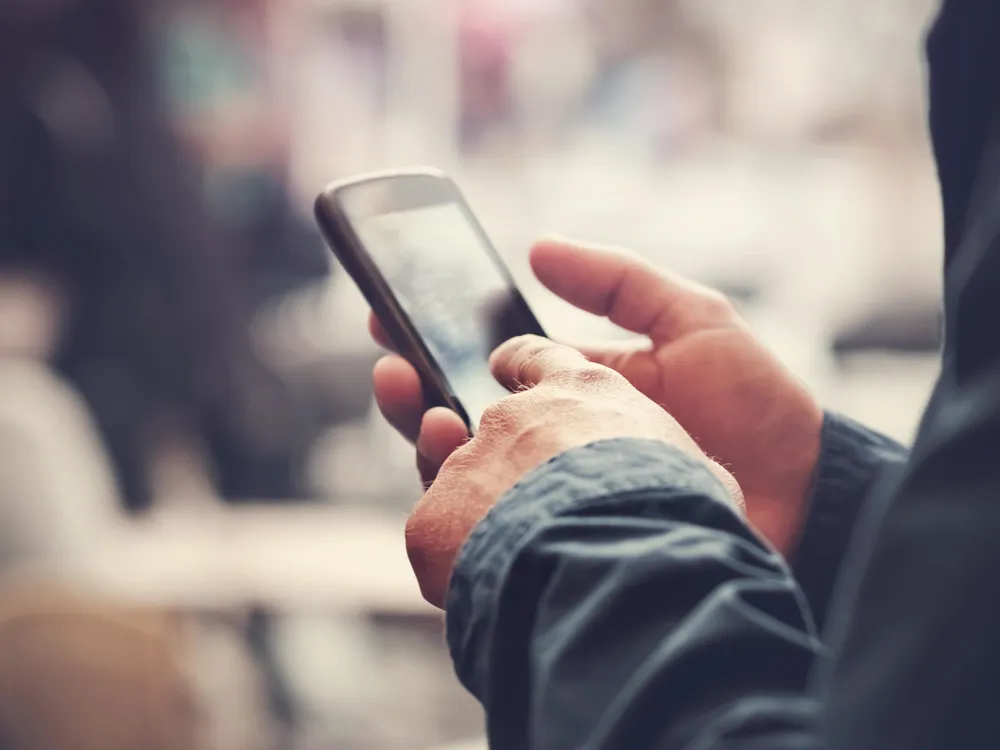 man holding cell phone.jpg