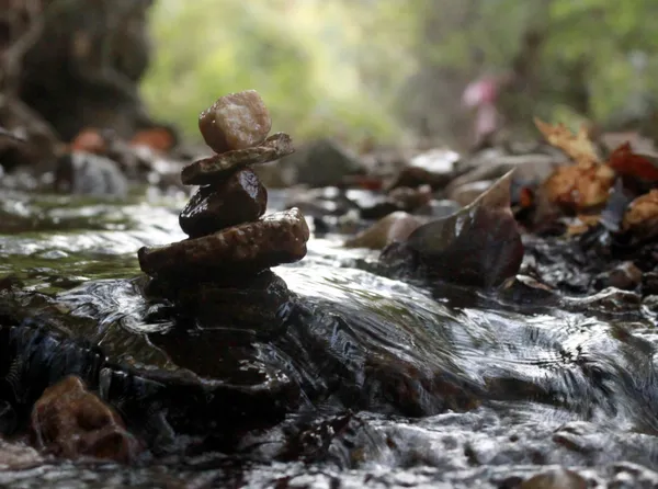 A stack of rocks in a Missouri creek during autumn. thumbnail