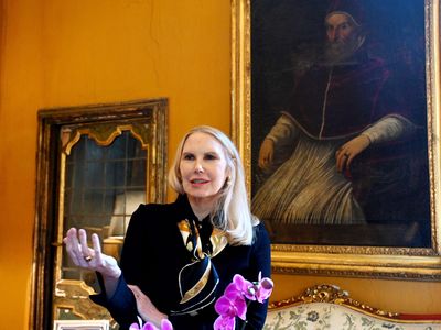 This photograph taken on January 21, 2022, shows the Princess Rita Boncompagni Ludovisi in front of a painting of Pope Gregorio XV at the Casino dell&#39;Aurora inside the Villa Boncompagni Ludovisi in Rome.