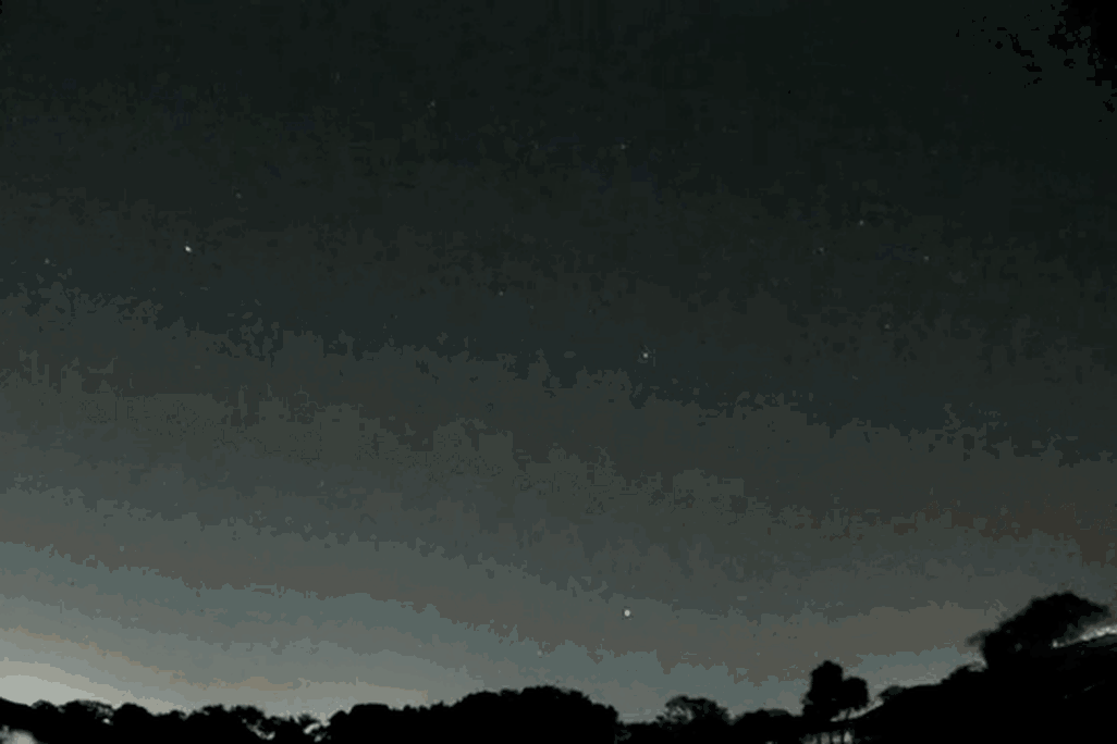 A gif of a meteor exploding over the Floridian night sky  