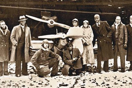 In the 1930s, Julian’s rival, John Robinson (at far right), founded a pilots’ association to promote aviation among African-Americans.