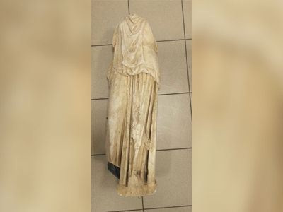 The recently discovered statue is missing its arms and head.