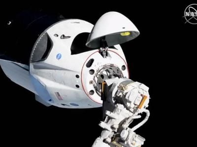 The SpaceX Crew Dragon spacecraft docked to the International Space Station. 