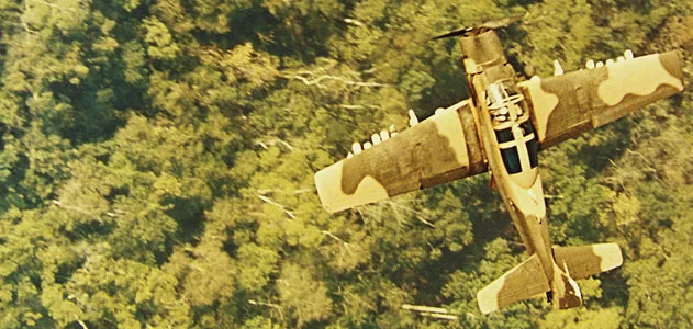 Over Vietnam in 1966, a Douglas A-1 flies cover on a rescue mission.