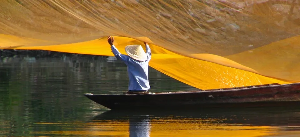  Throwing fishing nets along the river in Vietnam. Credit: Amanda Mack