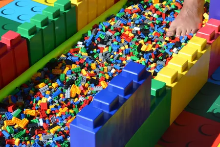 A brave soul walks on Legos at the U.K. Firewalk
