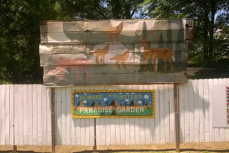 Signs welcome visitors to Howard Finster’s Paradise Garden.